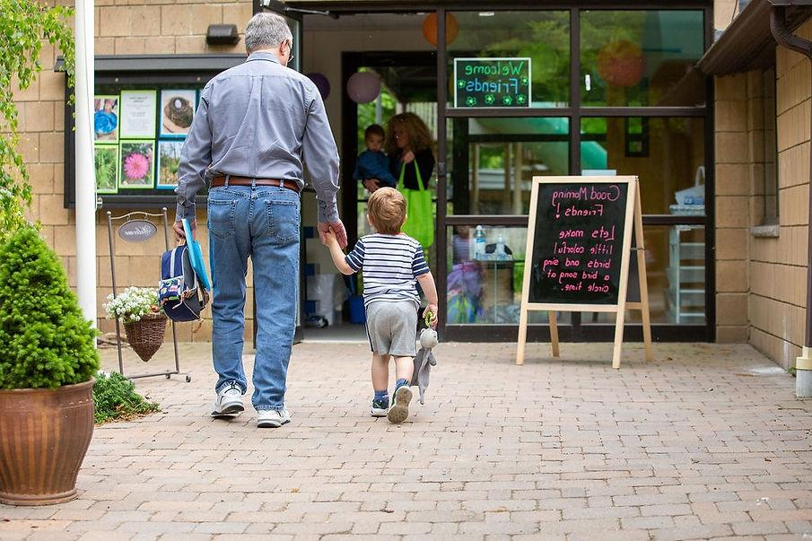 Parent dropping off their child at a nursery near Heathrow before work
